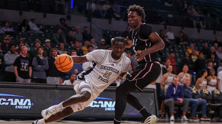 Dec 3, 2025; Atlanta, Georgia, USA; Georgia Tech Yellow Jackets forward Baye Ndongo (11) drives on Mississippi State Bulldogs center Quincy Ballard (15) in the second half at McCamish Pavilion. Mandatory Credit: Brett Davis-Imagn Images Dec 3, 2025; Atlanta, Georgia, USA; Georgia Tech Yellow Jackets forward Baye Ndongo (11) drives on Mississippi State Bulldogs center Quincy Ballard (15) in the second half at McCamish Pavilion. Mandatory Credit: Brett Davis-Imagn Images