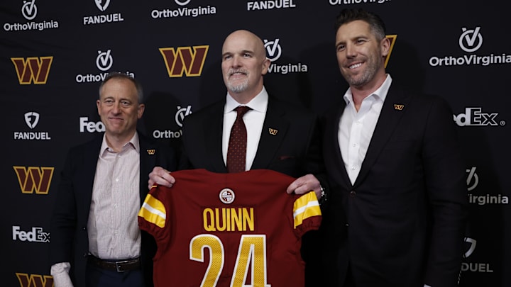 Feb 5, 2024; Ashburn, VA, USA; Washington Commanders head coach Dan Quinn (M) poses for a picture with Commanders managing partner Josh Harris (L) and Washington Commanders general manager Adam Peters (R) at an introductory press conference at Commanders Park. Mandatory Credit: Geoff Burke-USA TODAY Sports