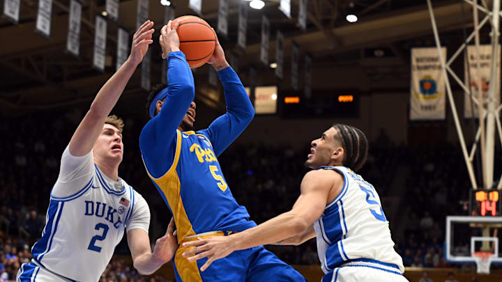 Jan 7, 2025; Durham, North Carolina, USA; Pittsburgh Panthers guard Ishmael Leggett (5) attempts to pass as Duke Blue Devils guard Tyrese Proctor (5) defends during the first half at Cameron Indoor Stadium. Mandatory Credit: Rob Kinnan-Imagn Images