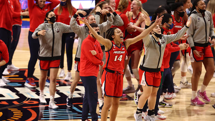 Apr 2, 2021; San Antonio, Texas, USA; Arizona Wildcats forward Sam Thomas (14) celebrates after defeating the UConn Huskies in the national semifinals of the women's Final Four of the 2021 NCAA Tournament at Alamodome. Mandatory Credit: Troy Taormina-Imagn Images Apr 2, 2021; San Antonio, Texas, USA; Arizona Wildcats forward Sam Thomas (14) celebrates after defeating the UConn Huskies in the national semifinals of the women's Final Four of the 2021 NCAA Tournament at Alamodome. Mandatory Credit: Troy Taormina-Imagn Images