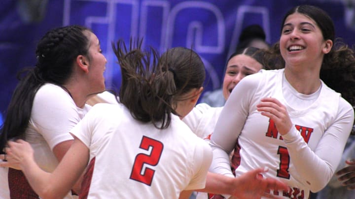 New Smyrna Beach players celebrate after defeating Gainesville 56-49 in the FHSAA Class 5A high school girls basketball final on March 7, 2025. [Clayton Freeman/Florida Times-Union]