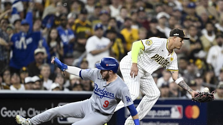 Oct 9, 2024; San Diego, California, USA; Los Angeles Dodgers second baseman Gavin Lux (9) slides into third against San Diego Padres third baseman Manny Machado (13) in the second inning during game four of the NLDS for the 2024 MLB Playoffs at Petco Park. Mandatory Credit: Denis Poroy-Imagn Images Oct 9, 2024; San Diego, California, USA; Los Angeles Dodgers second baseman Gavin Lux (9) slides into third against San Diego Padres third baseman Manny Machado (13) in the second inning during game four of the NLDS for the 2024 MLB Playoffs at Petco Park. Mandatory Credit: Denis Poroy-Imagn Images