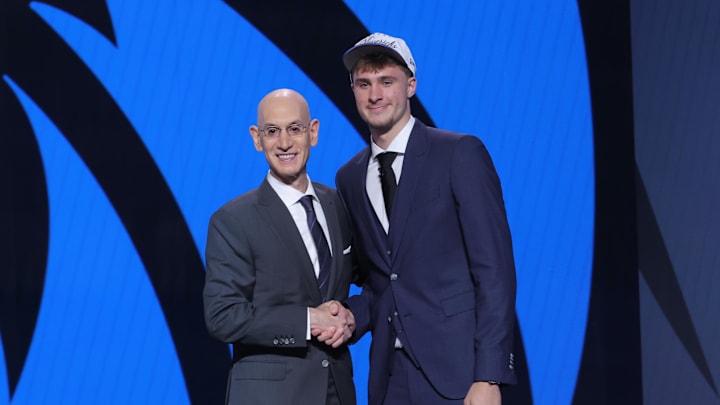 Jun 25, 2025; Brooklyn, NY, USA;  Cooper Flagg poses with NBA commissioner Adam Silver after being selected as first overall by the Dallas Mavericks in the first round of the 2025 NBA Draft at Barclays Center. Mandatory Credit: Brad Penner-Imagn Images