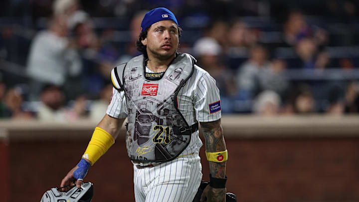 Sep 16, 2025; New York City, New York, USA; New York Mets catcher Francisco Alvarez (4) walks off the field after the top of the eighth inning against the San Diego Padres while wearing a chest protector honoring Puerto Rican professional baseball player Roberto Clemente at Citi Field. Mandatory Credit: Vincent Carchietta-Imagn Images