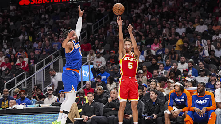 Nov 6, 2024; Atlanta, Georgia, USA; Atlanta Hawks guard Dyson Daniels (5) shoots against New York Knicks guard Jalen Brunson (11) during the second half at State Farm Arena. Mandatory Credit: Dale Zanine-Imagn Images