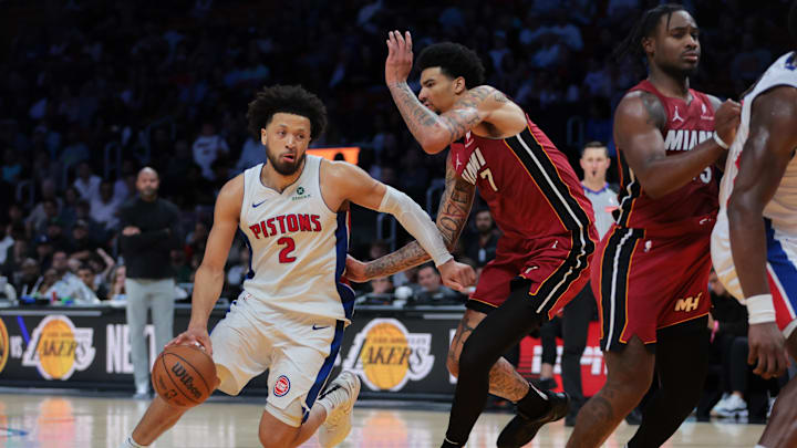Mar 19, 2025; Miami, Florida, USA; Detroit Pistons guard Cade Cunningham (2) drives to the basket past Miami Heat center Kel'el Ware (7) during the fourth quarter at Kaseya Center. Mandatory Credit: Sam Navarro-Imagn Images