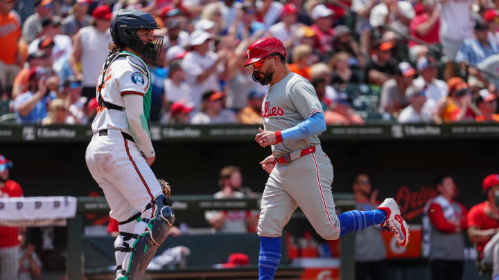 Philadelphia Phillies designated hitter Kyle Schwarber (12) scores a run on Philadelphia Phillies third baseman Alec Bohm (not pictured) RBI single against the Baltimore Orioles during the fifth inning at Oriole Park at Camden Yards on June 16.