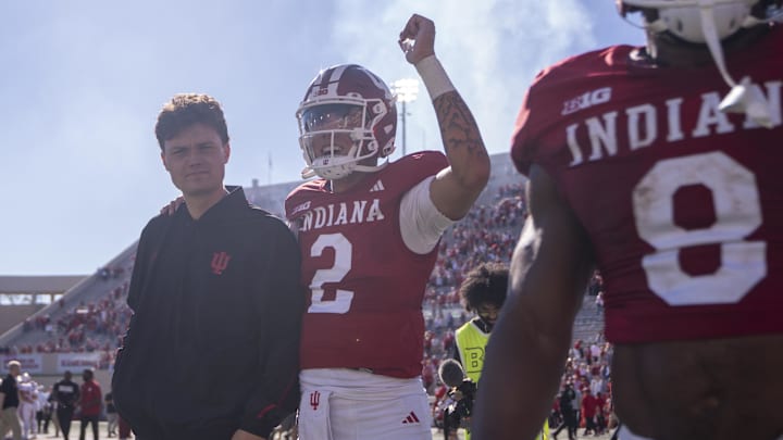 Oct 19, 2024; Bloomington, Indiana, USA; Indiana Hoosiers quarterback Tayven Jackson (2) walks with Indiana Hoosiers quarterback Kurtis Rourke (9) after beating the Nebraska Cornhuskers at Memorial Stadium. Mandatory Credit: Jacob Musselman-Imagn Images