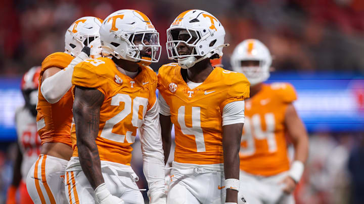 Aug 30, 2025; Atlanta, Georgia, USA; Tennessee Volunteers defensive lineman Jordan Ross (29) celebrates with defensive back Ty Redmond (4) after a tackle against the Syracuse Orange in the third quarter at Mercedes-Benz Stadium. Mandatory Credit: Brett Davis-Imagn Images
