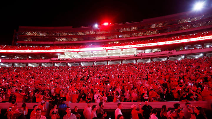 Georgia fans light up Sanford Stadium as the game goes into the fourth during the second half of a NCAA college football game against Tennessee Martin in Athens, Ga., on Saturday, Sept. 2, 2023. Georgia won 48-7.
