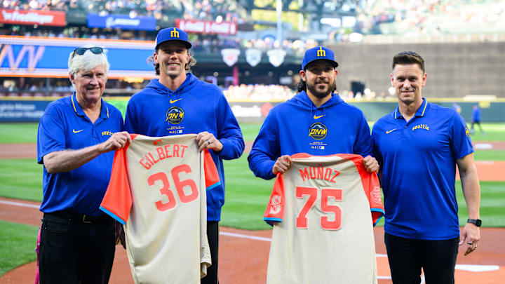 Seattle Mariners chairman John Stanton and president, of baseball operations Jerry Dipoto present all-star jerseys to pitchers Logan Gilbert (36) & Andres Munoz (75) before the game between the Seattle Mariners and the Houston Astros at T-Mobile Park on July 19.