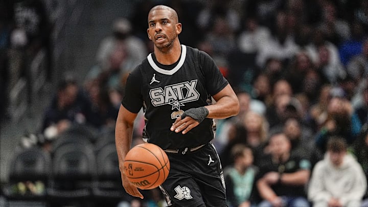 Feb 7, 2025; Charlotte, North Carolina, USA;  San Antonio Spurs guard Chris Paul (3) brings the ball up court against the Charlotte Hornets during the second half at Spectrum Center. Mandatory Credit: Jim Dedmon-Imagn Images