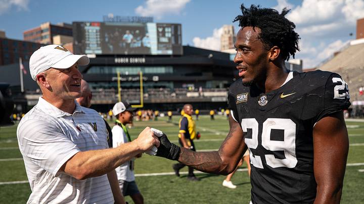 Vanderbilt defensive end Miles Capers (29) celebrates with coach Clark Lea after defeating NC State at FirstBank Stadium in Nashville, Tenn., Saturday, Sept. 19, 2026. Vanderbilt defensive end Miles Capers (29) celebrates with coach Clark Lea after defeating NC State at FirstBank Stadium in Nashville, Tenn., Saturday, Sept. 19, 2026.