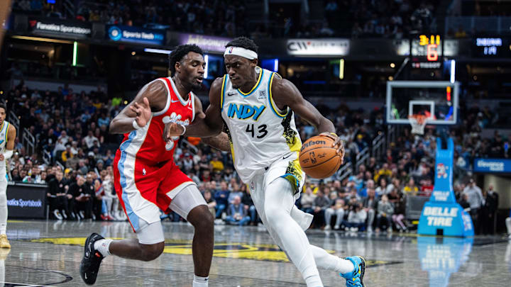 Feb 20, 2025; Indianapolis, Indiana, USA; Indiana Pacers forward Pascal Siakam (43) dribbles the ball while Memphis Grizzlies guard Vince Williams Jr. (5)defends in the second half at Gainbridge Fieldhouse. Mandatory Credit: Trevor Ruszkowski-Imagn Images