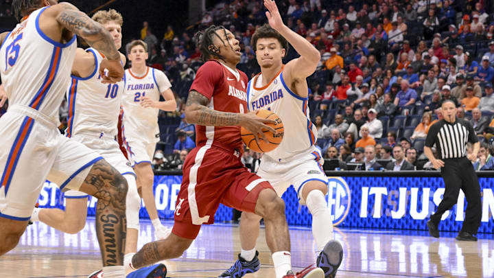 Mar 15, 2025; Nashville, TN, USA;  Alabama Crimson Tide guard Labaron Philon (0) drives to the basket against the Florida Gators during the second half at Bridgestone Arena. Mandatory Credit: Steve Roberts-Imagn Images