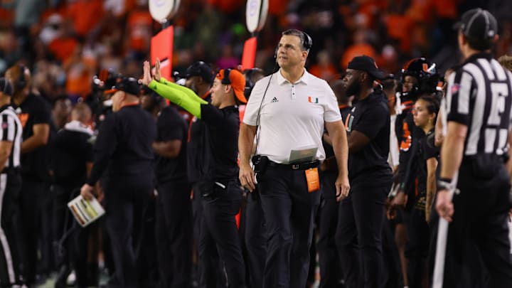Oct 26, 2024; Miami Gardens, Florida, USA; Miami Hurricanes head coach Mario Cristobal watches from the sideline against the Florida State Seminoles during the third quarter at Hard Rock Stadium. Mandatory Credit: Sam Navarro-Imagn Images