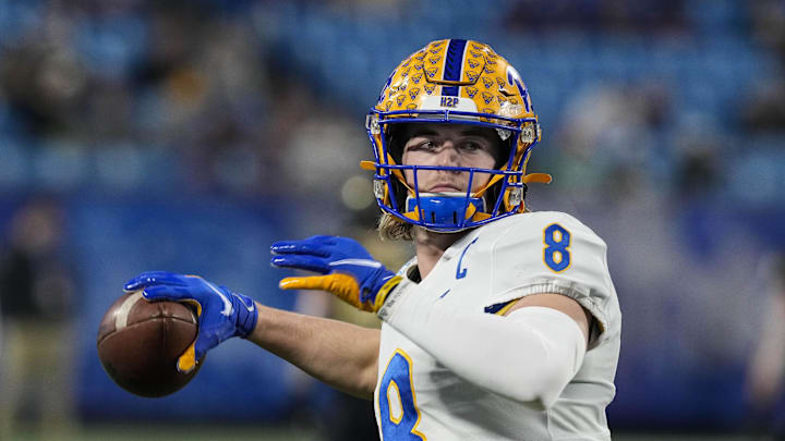 Dec 4, 2021; Charlotte, NC, USA; Pittsburgh Panthers quarterback Kenny Pickett (8) warms up before the ACC championship game against the Wake Forest Demon Deacons at Bank of America Stadium. Mandatory Credit: Jim Dedmon-Imagn Images