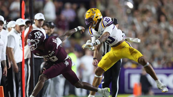 Oct 25, 2025; Baton Rouge, Louisiana, USA; Louisiana State Tigers safety Dashawn Spears (10) pushes Texas A&M Aggies quarterback Marcel Reed (10) out of bounds during the second half at Tiger Stadium. Mandatory Credit: Stephen Lew-Imagn Images