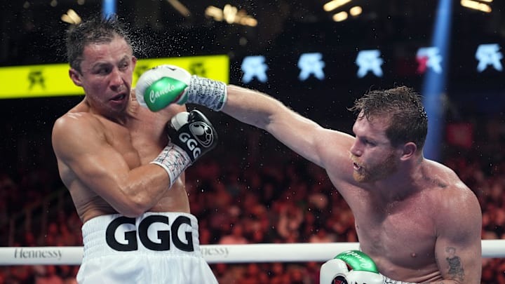 Canelo Alvarez (red trunks) and Gennadiy Golovkin (white trunks) box during a super middleweight championship bout at T-Mobile Arena. 