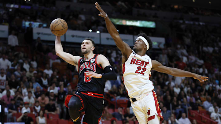 Apr 14, 2023; Miami, Florida, USA; Chicago Bulls guard Zach LaVine (8) drives to the basket ahead of Miami Heat forward Jimmy Butler (22) during the third quarter at Kaseya Center. Mandatory Credit: Sam Navarro-Imagn Images