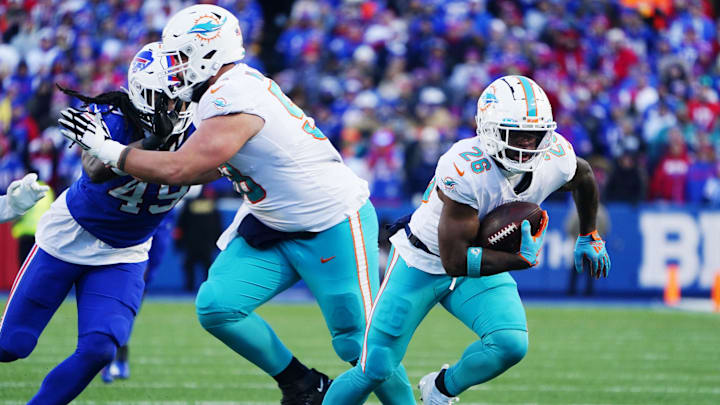 Jan 15, 2023; Orchard Park, NY, USA; Miami Dolphins running back Salvon Ahmed (26) runs the ball