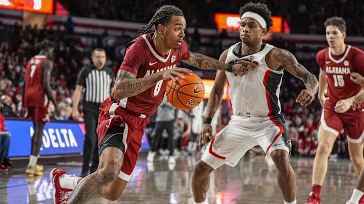 Mar 3, 2026; Athens, Georgia, USA; Alabama Crimson Tide guard Labaron Philon (0) dribbles against Georgia Bulldogs guard Marcus Millender (4) at Stegeman Coliseum. Mandatory Credit: Dale Zanine-Imagn Images