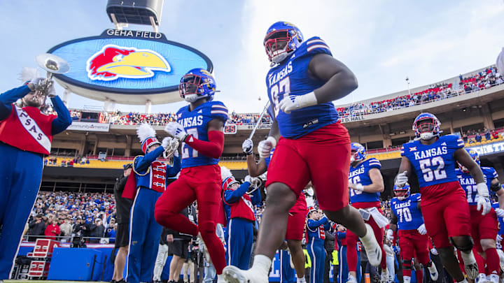 Nov 23, 2024; Kansas City, Missouri, USA;  The Kansas Jayhawks take the field agains the the Colorado Buffaloes at GEHA Field at Arrowhead Stadium. Mandatory Credit: Nick Tre. Smith-Imagn Images
