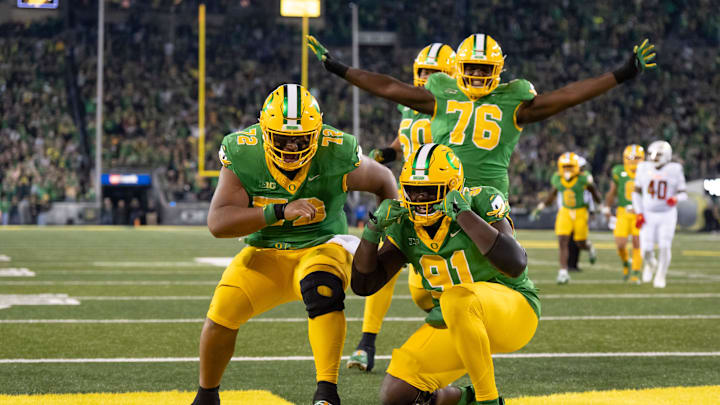 Players celebrate a touchdown by Oregon offensive lineman Gernorris Wilson as the Oregon Ducks host the Maryland Terrapins at Autzen Stadium Saturday, Nov. 9, 2024 in Eugene, Ore.