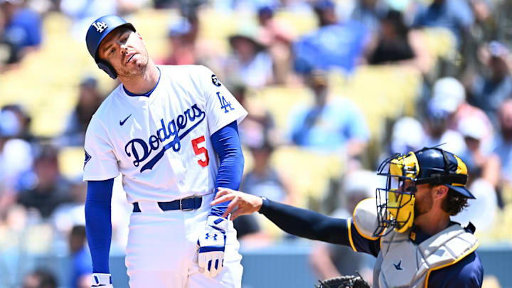 Jul 20, 2025; Los Angeles, California, USA; Los Angeles Dodgers first baseman Freddie Freeman (5) reacts to striking out against the Milwaukee Brewers during the second inning of the game at Dodger Stadium. Mandatory Credit: Jonathan Hui-Imagn Images