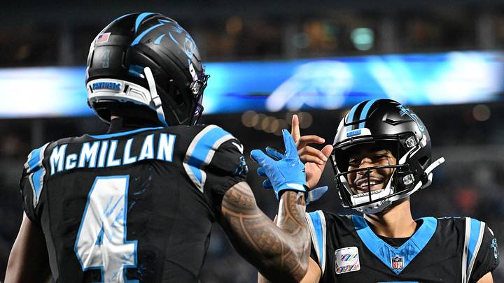 Oct 4, 2026; Charlotte, North Carolina, USA;  Carolina Panthers wide receiver Tetairoa McMillan (4) celebrates with quarterback Bryce Young (9) after scoring a touchdown against the Detroit Lions during the third quarter at Bank of America Stadium.  Mandatory Credit: Bob Donnan-Imagn Images