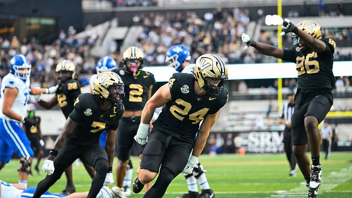 Nov 22, 2025; Nashville, Tennessee, USA; Vanderbilt Commodores linebacker Nick Rinaldi (24) celebrates the sack of Kentucky Wildcats quarterback Cutter Boley (8) during the first half at FirstBank Stadium. Mandatory Credit: Steve Roberts-Imagn Images Nov 22, 2025; Nashville, Tennessee, USA; Vanderbilt Commodores linebacker Nick Rinaldi (24) celebrates the sack of Kentucky Wildcats quarterback Cutter Boley (8) during the first half at FirstBank Stadium. Mandatory Credit: Steve Roberts-Imagn Images