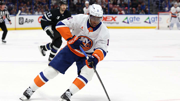 Mar 29, 2025; Tampa, Florida, USA; New York Islanders left wing Anthony Duclair (11) skates with the puck against the Tampa Bay Lightning during the first period at Amalie Arena. Mandatory Credit: Kim Klement Neitzel-Imagn Images