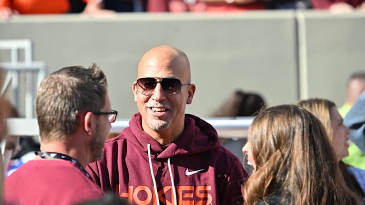 Blacksburg, Virginia, USA; Incoming head coach James Franklin speaks to fans on the sideline before the game at Lane Stadium.