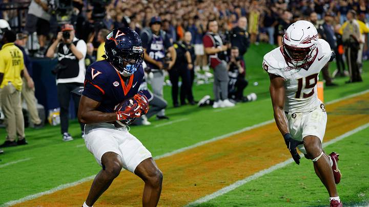 Sep 26, 2025; Charlottesville, Virginia, USA; Virginia Cavaliers wide receiver Trell Harris (11) catches a two point conversion as Florida State Seminoles defensive back Jerry Wilson (19) defends in the second overtime period at Scott Stadium. Mandatory Credit: Geoff Burke-Imagn Images Sep 26, 2025; Charlottesville, Virginia, USA; Virginia Cavaliers wide receiver Trell Harris (11) catches a two point conversion as Florida State Seminoles defensive back Jerry Wilson (19) defends in the second overtime period at Scott Stadium. Mandatory Credit: Geoff Burke-Imagn Images
