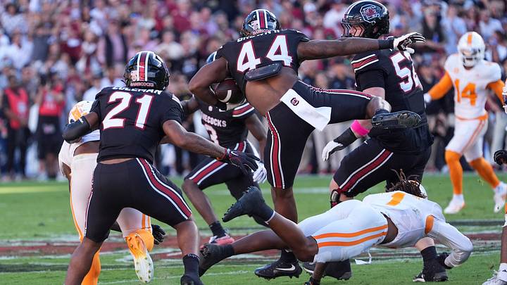 Oct 24, 2026; Columbia, South Carolina, USA; South Carolina Gamecocks defensive back KJ Johnson (44) hurdles past Tennessee Volunteers defensive back TJ Metcalf (1) during the first half at Williams-Brice Stadium. Mandatory Credit: Jim Dedmon-Imagn Images Oct 24, 2026; Columbia, South Carolina, USA; South Carolina Gamecocks defensive back KJ Johnson (44) hurdles past Tennessee Volunteers defensive back TJ Metcalf (1) during the first half at Williams-Brice Stadium. Mandatory Credit: Jim Dedmon-Imagn Images