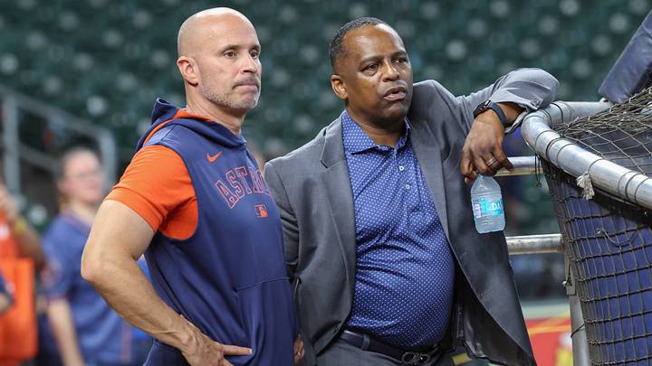 Houston Astros manager Joe Espada (left) and general manager Dana Brown (right) talk on the field. Houston Astros manager Joe Espada (left) and general manager Dana Brown (right) talk on the field.