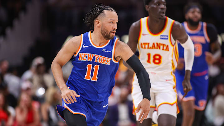 New York Knicks guard Jalen Brunson (11) dribbles against the Atlanta Hawks in the second quarter during game six of the first round of the 2026 NBA Playoffs at State Farm Arena.