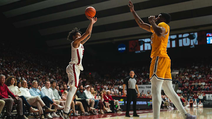 Dec 22, 2024; Tuscaloosa, Alabama, USA; Alabama Crimson Tide guard Houston Mallette (95) shoots from the three point line against Kent State Golden Flashes center Cli'Ron Hornbeak (42) during the second half at Coleman Coliseum. Mandatory Credit: Will McLelland-Imagn Images Dec 22, 2024; Tuscaloosa, Alabama, USA; Alabama Crimson Tide guard Houston Mallette (95) shoots from the three point line against Kent State Golden Flashes center Cli'Ron Hornbeak (42) during the second half at Coleman Coliseum. Mandatory Credit: Will McLelland-Imagn Images