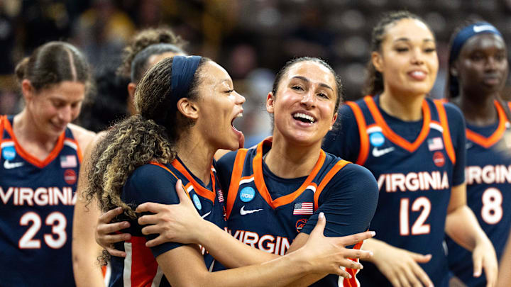 Virginia guard Paris Clark (1) hugs Virginia guard Jillian Brown (4) after the Virginia Cavaliers upset the Georgia Bulldogs March 21, 2026 during a First Round NCAA March Madness game at Carver-Hawkeye Arena in Iowa City, Iowa.