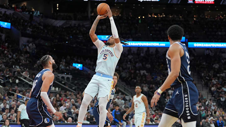 Mar 12, 2025; San Antonio, Texas, USA; San Antonio Spurs guard Stephon Castle (5) shoos over Dallas Mavericks forward Caleb Martin (16) in the first half at Frost Bank Center. Mandatory Credit: Daniel Dunn-Imagn Images Mar 12, 2025; San Antonio, Texas, USA; San Antonio Spurs guard Stephon Castle (5) shoos over Dallas Mavericks forward Caleb Martin (16) in the first half at Frost Bank Center. Mandatory Credit: Daniel Dunn-Imagn Images