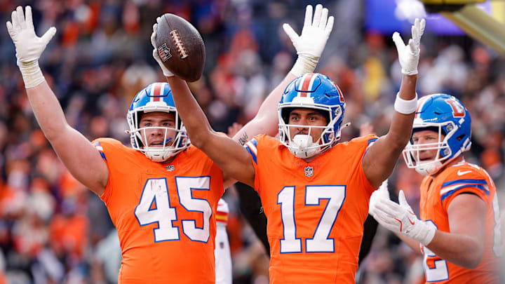 Jan 5, 2025; Denver, Colorado, USA; Denver Broncos wide receiver Devaughn Vele (17) celebrates  his touchdown with tight end Nate Adkins (45) and tight end Adam Trautman (82) in the second quarter against the Kansas City Chiefs at Empower Field at Mile High. 