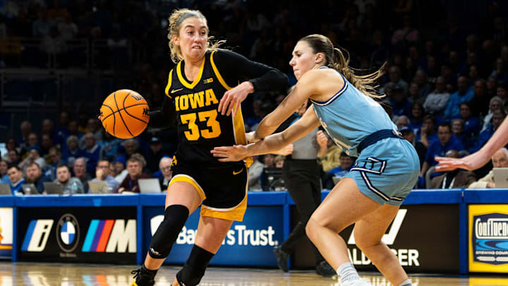 Iowa guard Lucy Olsen (33) drives to the basket during the Drake vs. Iowa basketball game at Knapp Center on Sunday, Nov. 17, 2024, in Des Moines. Iowa guard Lucy Olsen (33) drives to the basket during the Drake vs. Iowa basketball game at Knapp Center on Sunday, Nov. 17, 2024, in Des Moines.