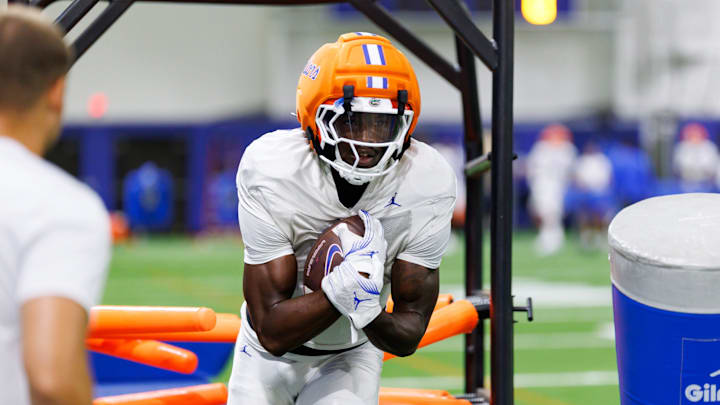 Florida Gators tight end Amir Jackson (7) runs with the ball during fall football practice at Sanders Indoor Practice Facility at the University of Florida in Gainesville, FL on Thursday, August 14, 2025. [Matt Pendleton/Gainesville Sun]
