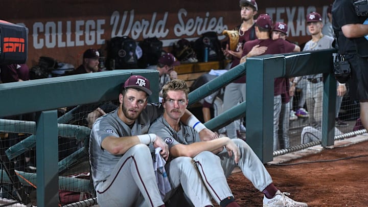 Jun 24, 2024; Omaha, NE, USA;  Texas A&M Aggies third baseman Gavin Grahovac (9) and designated hitter Hayden Schott (5) look over the field after the loss against the Tennessee Volunteers at Charles Schwab Field Omaha. Mandatory Credit: Steven Branscombe-Imagn Images