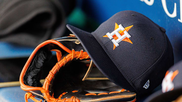Apr 27, 2025; Kansas City, Missouri, USA; Houston Astros hat and glove in the dugout during the second inning against the Kansas City Royals at Kauffman Stadium. Apr 27, 2025; Kansas City, Missouri, USA; Houston Astros hat and glove in the dugout during the second inning against the Kansas City Royals at Kauffman Stadium.