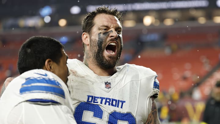 Nov 9, 2025; Landover, Maryland, USA; Detroit Lions offensive tackle Penei Sewell (L) celebrates with Lions offensive tackle Taylor Decker (68) while leaving the field after their game against the Washington Commanders at Northwest Stadium. Mandatory Credit: Geoff Burke-Imagn Images