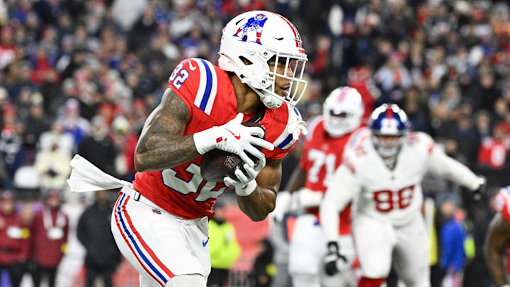 Dec 1, 2025; Foxborough, Massachusetts, USA; New England Patriots running back TreVeyon Henderson (32) runs the ball during the second quarter against the New York Giants at Gillette Stadium. Mandatory Credit: Eric Canha-Imagn Images
