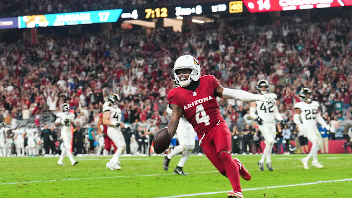 Nov 23, 2025; Glendale, Arizona, USA; Arizona Cardinals wide receiver Greg Dortch (4) celebrates after scoring a touchdown during the fourth quarter against the Jacksonville Jaguars  at State Farm Stadium. Mandatory Credit: Joe Camporeale-Imagn Images