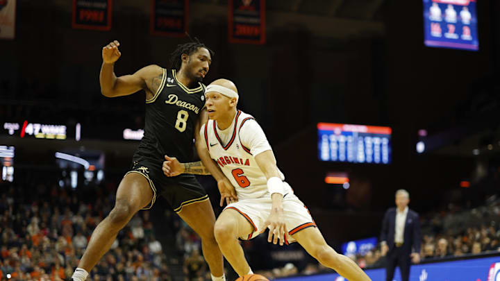 Mar 3, 2026; Charlottesville, Virginia, USA; Virginia Cavaliers guard Jacari White (6) drives to the basket as Wake Forest Demon Deacons guard Mekhi Mason (8) defends in the second half at John Paul Jones Arena. Mandatory Credit: Geoff Burke-Imagn Images Mar 3, 2026; Charlottesville, Virginia, USA; Virginia Cavaliers guard Jacari White (6) drives to the basket as Wake Forest Demon Deacons guard Mekhi Mason (8) defends in the second half at John Paul Jones Arena. Mandatory Credit: Geoff Burke-Imagn Images