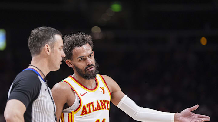 Feb 20, 2025; Atlanta, Georgia, USA; Atlanta Hawks guard Trae Young (11) discusses a play with the official during the game against the Orlando Magic during the first half at State Farm Arena. Mandatory Credit: Dale Zanine-Imagn Images